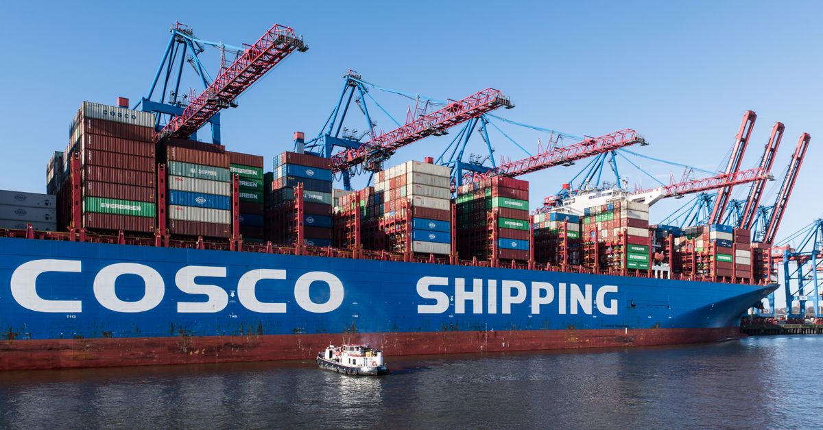 Container ship docked at Hamburg Port showing global trade and shipping logistics.